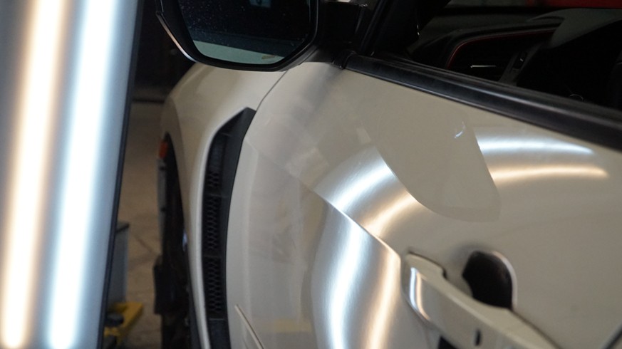 white car after removing dents.