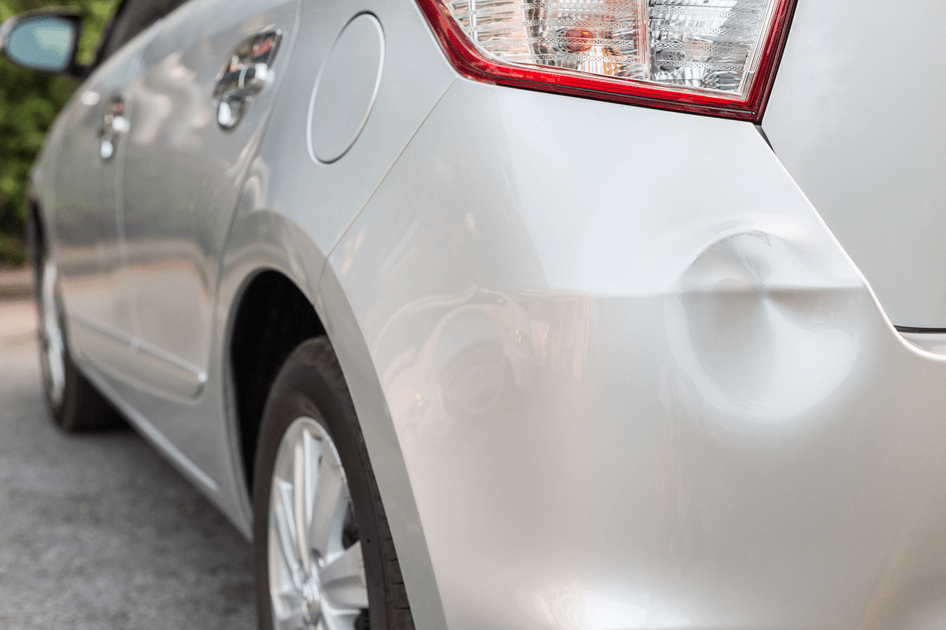 Backside of silver car get damaged by accident